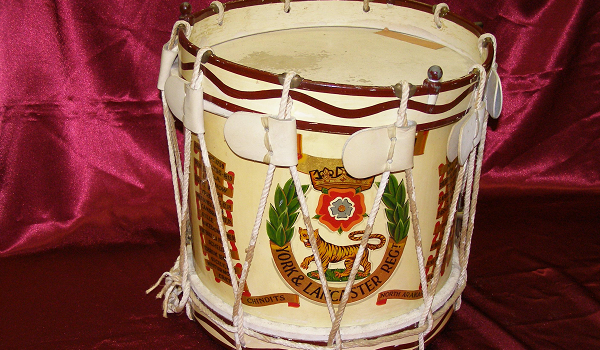 White drum with York and Lancs crest on front