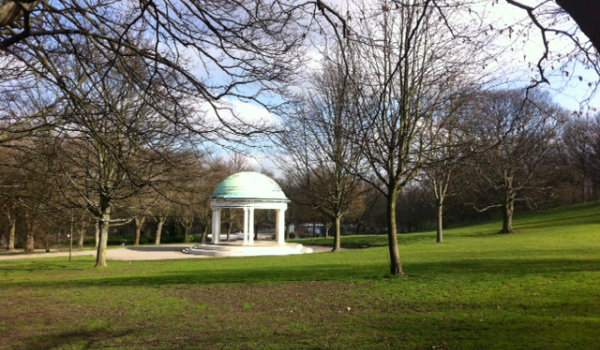 Bandstand in Autum surrounded by trees and dropped leaves