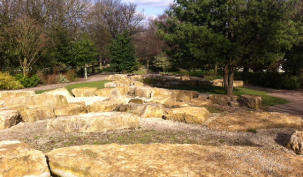 Clifton Park Rock Garden with trees in the background.