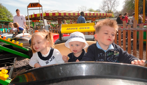 Young children having fun on a ride