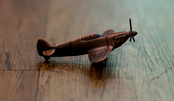 Small copper hurricane airplane model.